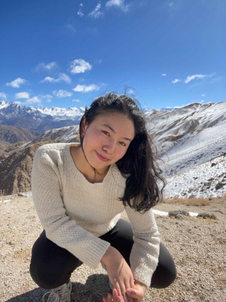 Front view of hand-knitted lambswool sweater in natural undyed wool